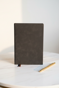Charcoal grey soft faux leather A5 journal on marble desk