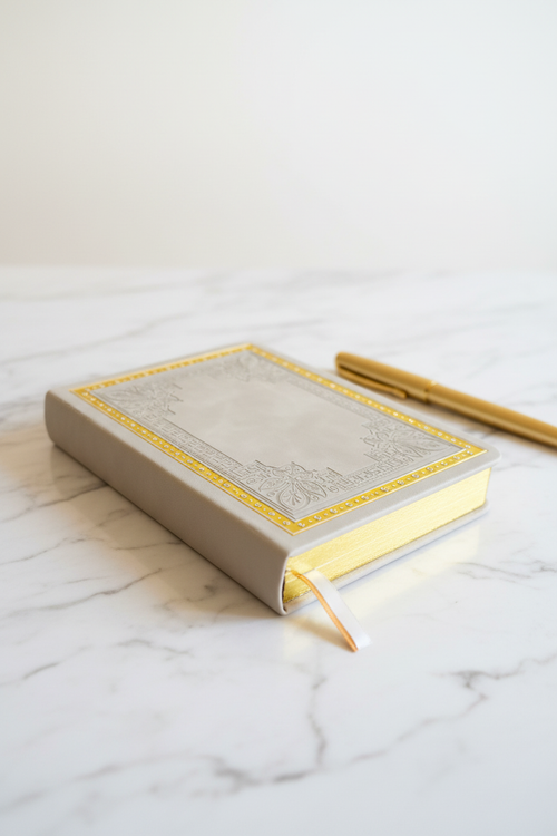 Beige butterfly Greek key gilded A6 journal on marble desk