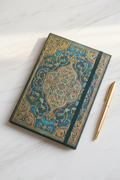 Iridescent teal gold embossed A5 sketchbook on marble desk
