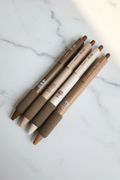 4 MOKA coffee themed soft grip gel pens in espresso, latte, cream and caramel on marble desk