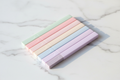 Set of 6 pastel highlighter pens on marble desk