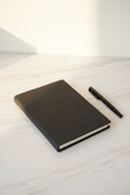 Black soft suede A5 notebook on marble desk